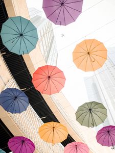 Preview wallpaper umbrellas, colorful, plane, buildings