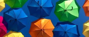 Preview wallpaper umbrellas, colorful, sky, sunny