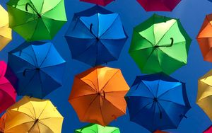 Preview wallpaper umbrellas, colorful, sky, sunny