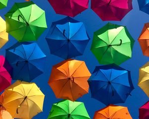 Preview wallpaper umbrellas, colorful, sky, sunny