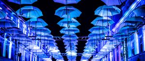 Preview wallpaper umbrellas, scenery, street, illumination, lights