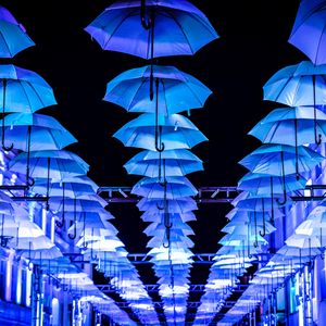 Preview wallpaper umbrellas, scenery, street, illumination, lights