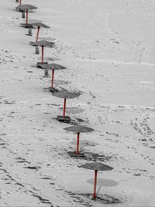 Preview wallpaper umbrellas, winter, snow, beach, landscape, red, bw