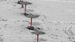 Preview wallpaper umbrellas, winter, snow, beach, landscape, red, bw