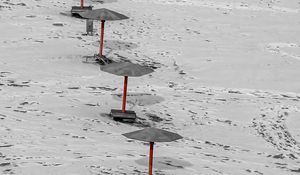 Preview wallpaper umbrellas, winter, snow, beach, landscape, red, bw