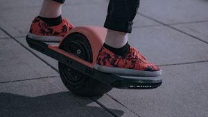 Preview wallpaper unicycle, legs, sneakers, road