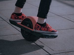 Preview wallpaper unicycle, legs, sneakers, road