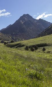 Preview wallpaper valley, grass, mountains, landscape, nature