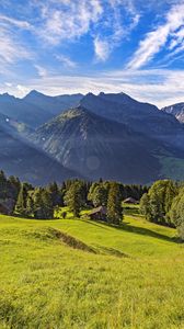 Preview wallpaper valley, grass, trees, mountains, sunlight, landscape