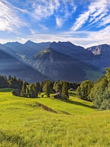 Preview wallpaper valley, grass, trees, mountains, sunlight, landscape