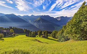 Preview wallpaper valley, grass, trees, mountains, sunlight, landscape