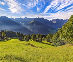 Preview wallpaper valley, grass, trees, mountains, sunlight, landscape