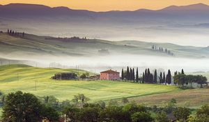 Preview wallpaper valley, home, fog, slopes, plain, trees, mountains