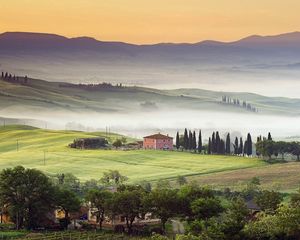 Preview wallpaper valley, home, fog, slopes, plain, trees, mountains