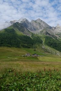 Preview wallpaper valley, house, mountains, grass, landscape