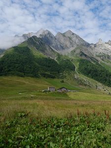 Preview wallpaper valley, house, mountains, grass, landscape