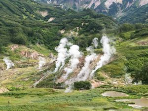 Preview wallpaper valley, mountains, grass, smoke, nature