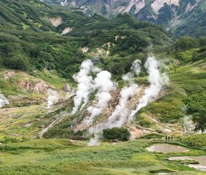 Preview wallpaper valley, mountains, grass, smoke, nature