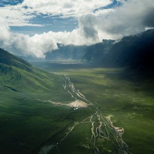 Preview wallpaper valley, road, aerial view, hills, clouds, landscape