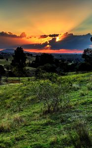 Preview wallpaper valley, sunset, grass, sky