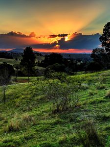 Preview wallpaper valley, sunset, grass, sky