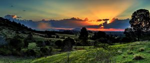 Preview wallpaper valley, sunset, grass, sky