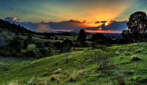 Preview wallpaper valley, sunset, grass, sky