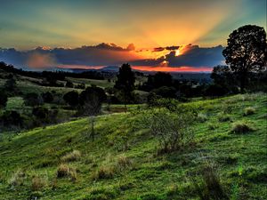 Preview wallpaper valley, sunset, grass, sky