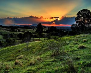 Preview wallpaper valley, sunset, grass, sky