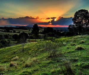 Preview wallpaper valley, sunset, grass, sky