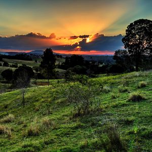 Preview wallpaper valley, sunset, grass, sky