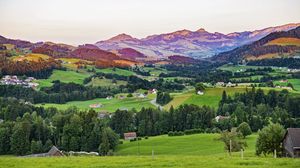 Preview wallpaper valley, trees, grass, houses, mountains