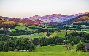 Preview wallpaper valley, trees, grass, houses, mountains