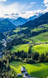 Preview wallpaper valley, trees, mountains, village, distance