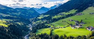 Preview wallpaper valley, trees, mountains, village, distance