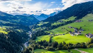 Preview wallpaper valley, trees, mountains, village, distance