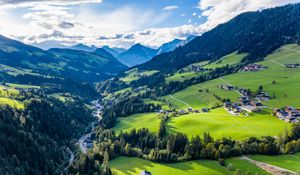 Preview wallpaper valley, trees, mountains, village, distance