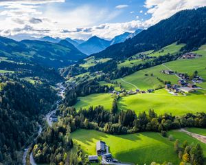 Preview wallpaper valley, trees, mountains, village, distance