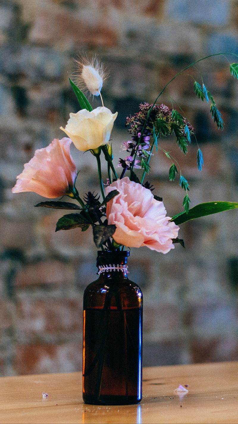 800x1420 Wallpaper vase, bottle, flowers
