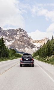 Preview wallpaper vehicle, suv, road, mountains, nature