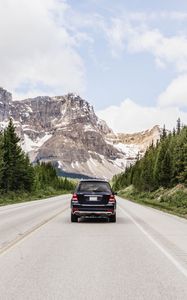 Preview wallpaper vehicle, suv, road, mountains, nature