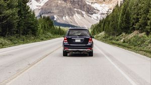 Preview wallpaper vehicle, suv, road, mountains, nature