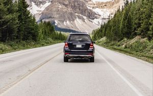 Preview wallpaper vehicle, suv, road, mountains, nature