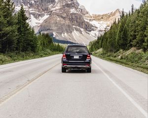 Preview wallpaper vehicle, suv, road, mountains, nature