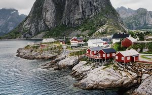 Preview wallpaper village, buildings, coast, rocks, sea
