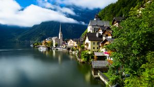 Preview wallpaper village, buildings, lake, mountain, clouds