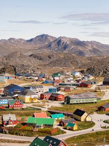 Preview wallpaper village, buildings, mountains, aerial view