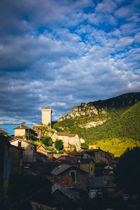 Preview wallpaper village, houses, mountains, trees, clouds, green, blue