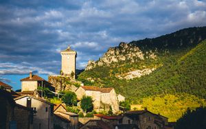 Preview wallpaper village, houses, mountains, trees, clouds, green, blue