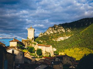 Preview wallpaper village, houses, mountains, trees, clouds, green, blue